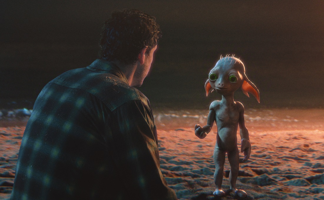 T.J. Power as Petey faces the small alien Allen on a beach at night.