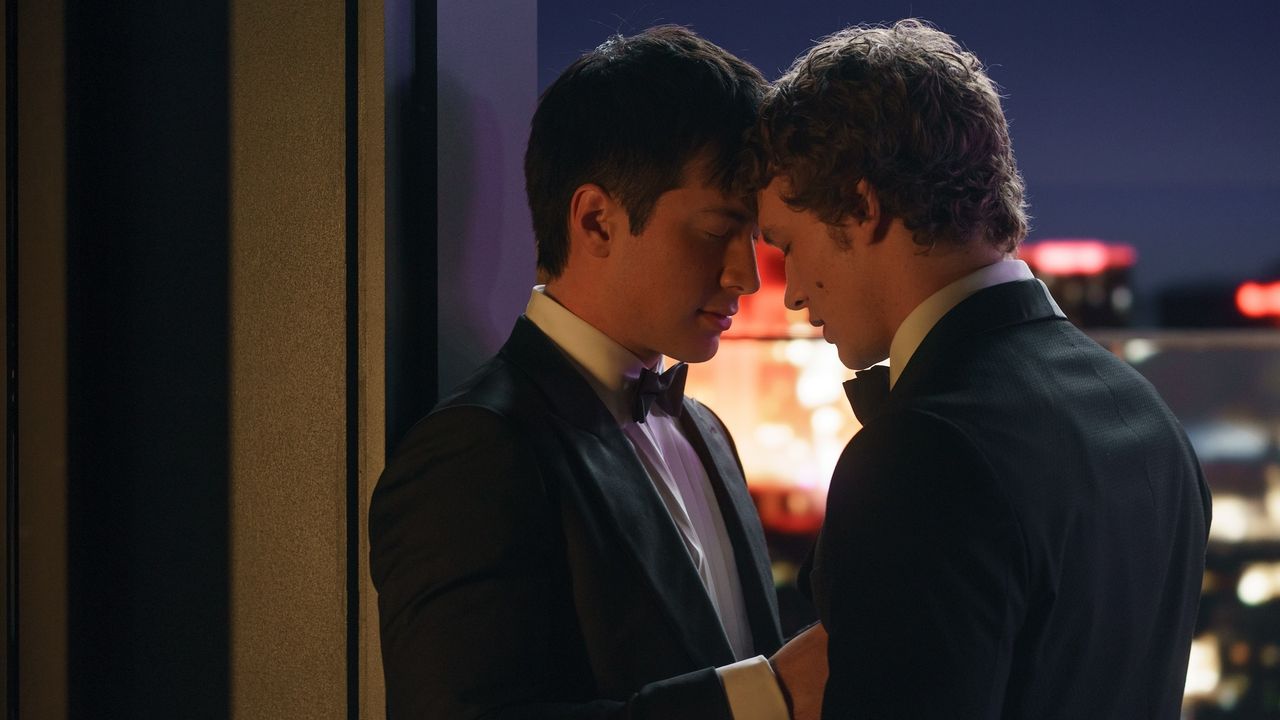 Hudson Williams as Shane Hollander and Connor Storrie as Ilya Rozanov, wearing tuxedos in a scene from Heated Rivalry season one.