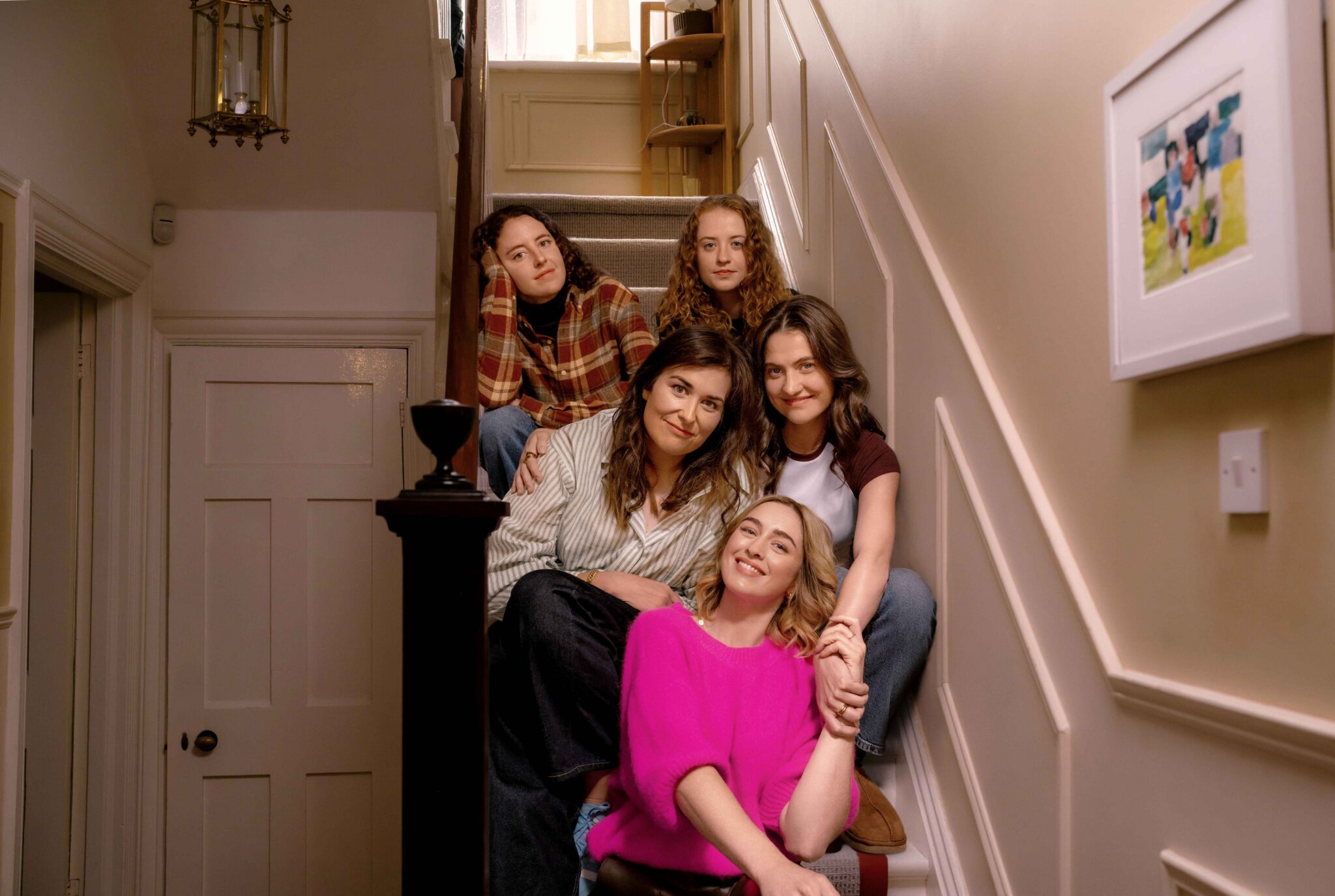 The five Walsh sisters together on a staircase in a supplied first-look photograph for season two.